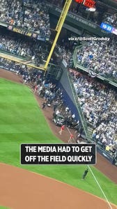 The media had to get off the field quickly