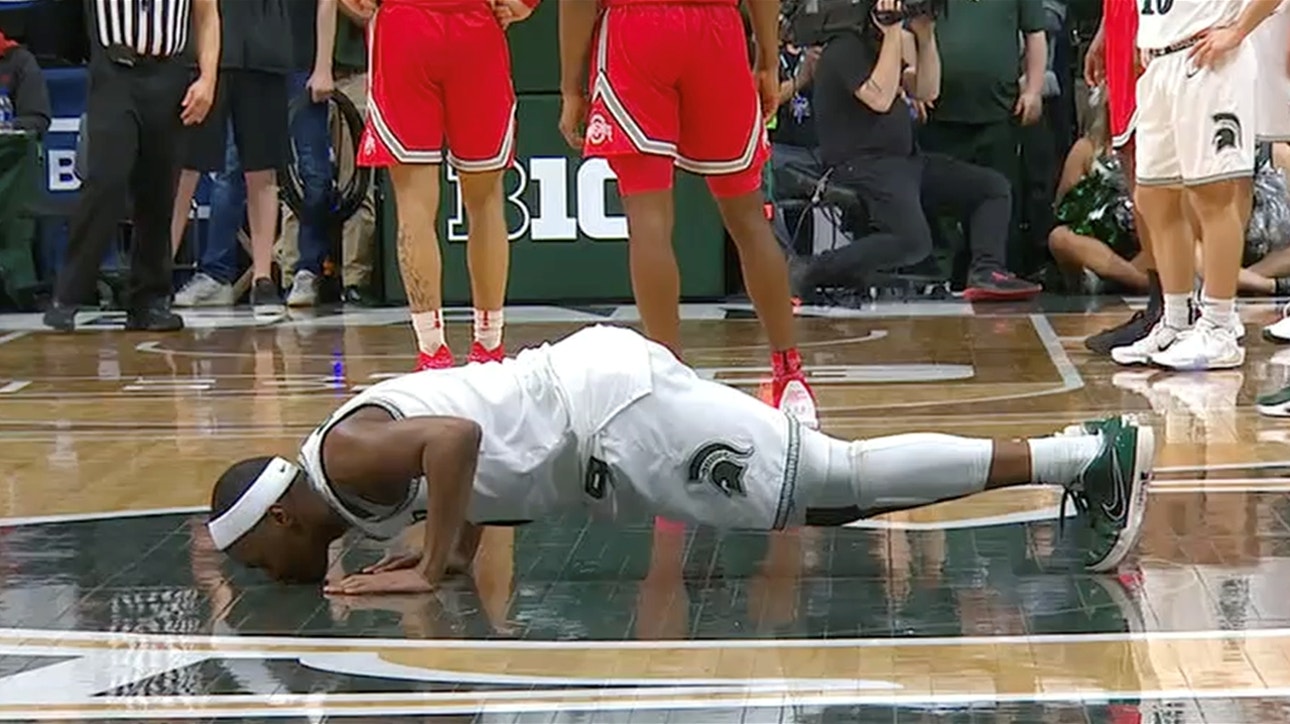 Cassius Winston and fellow Michigan State seniors kiss the Spartan logo in final home game