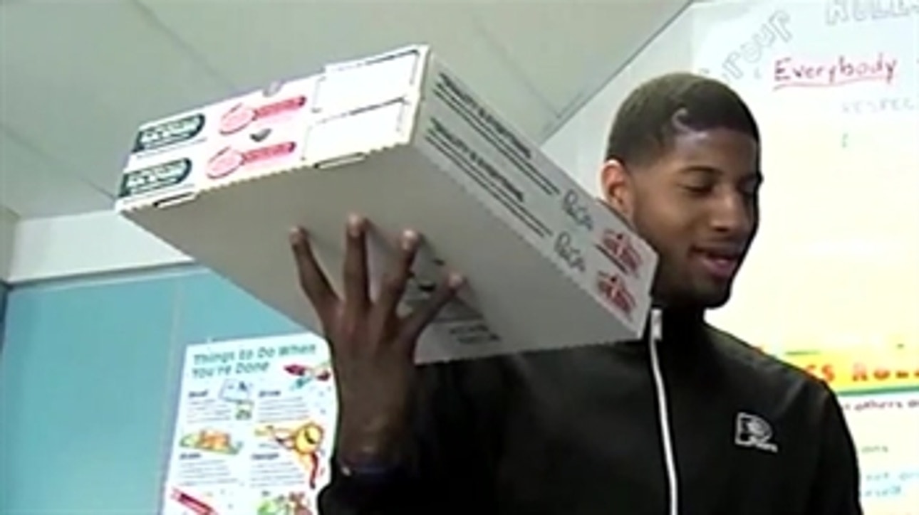 Paul George delivers pizza to local school