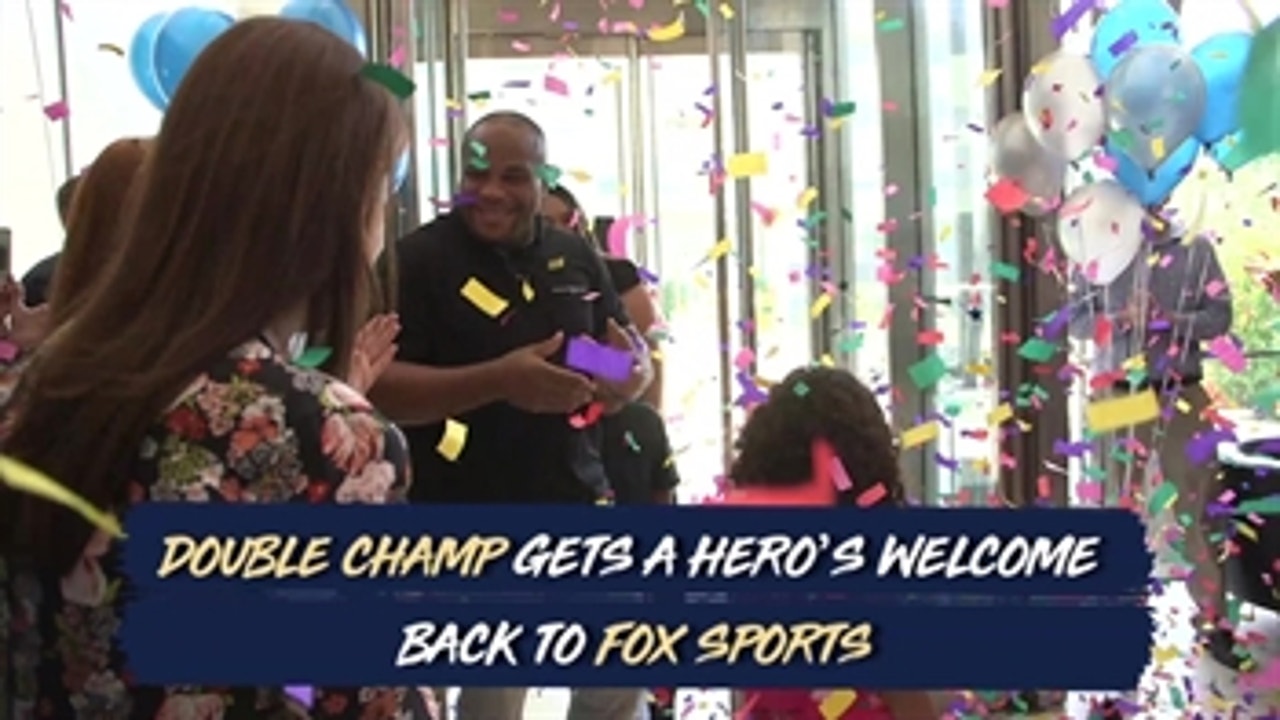 Daniel Cormier gets a hero's welcome in the double champ's return to the FOX Sports offices