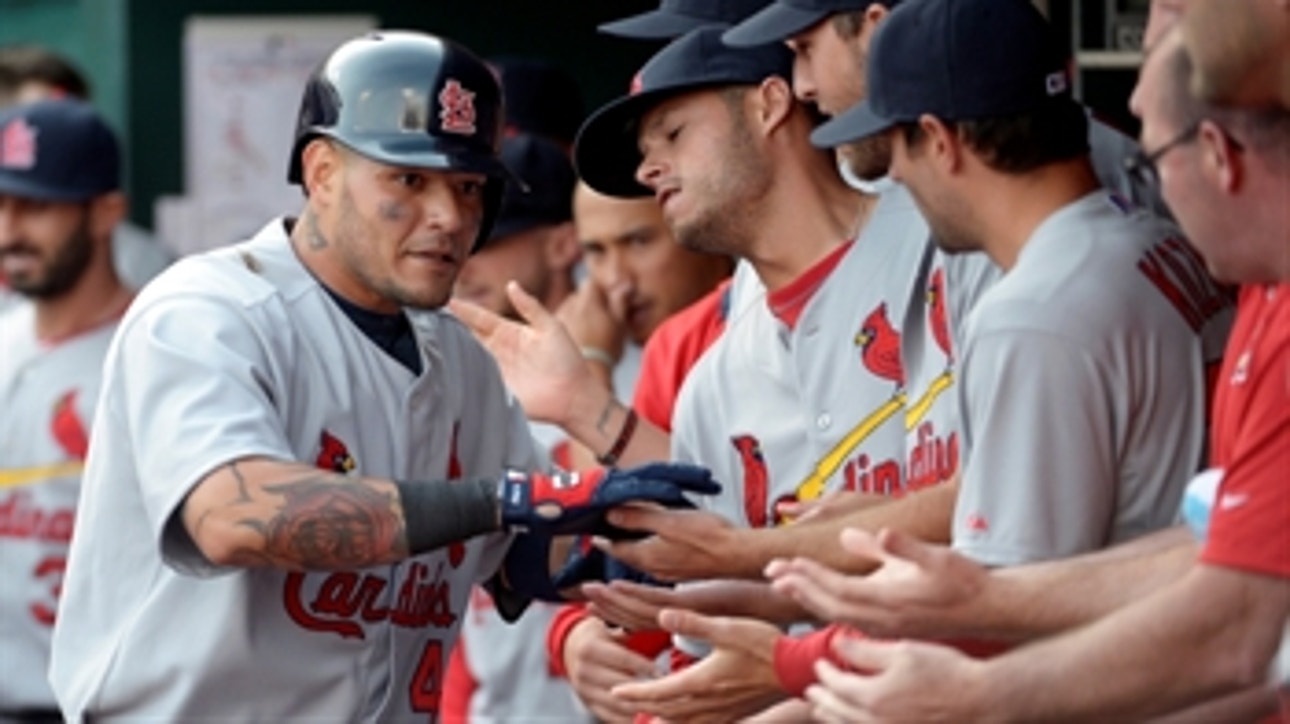 Molina helps Cards edge Reds in opener