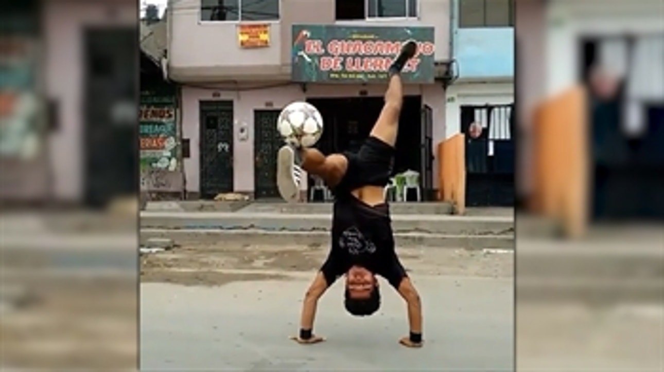 This man is really good at juggling... upside down!