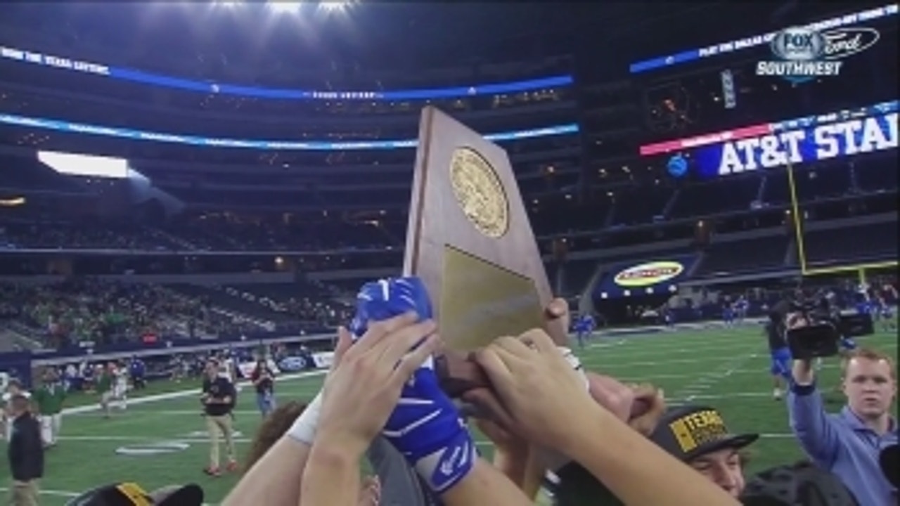 Gunter hoists the trophy as 3A Division II Champs