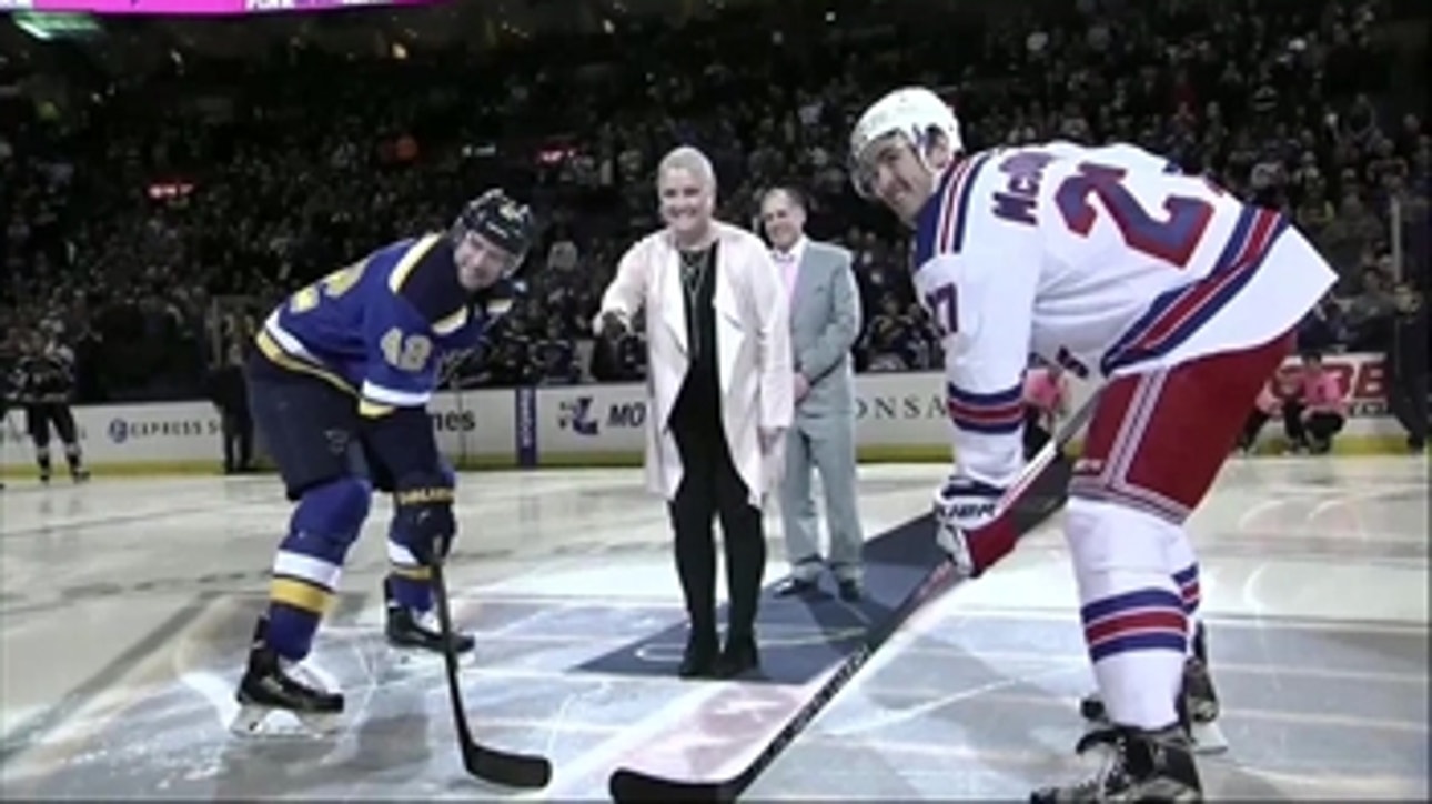 John and Jennifer Kelly participate in ceremonial puck drop