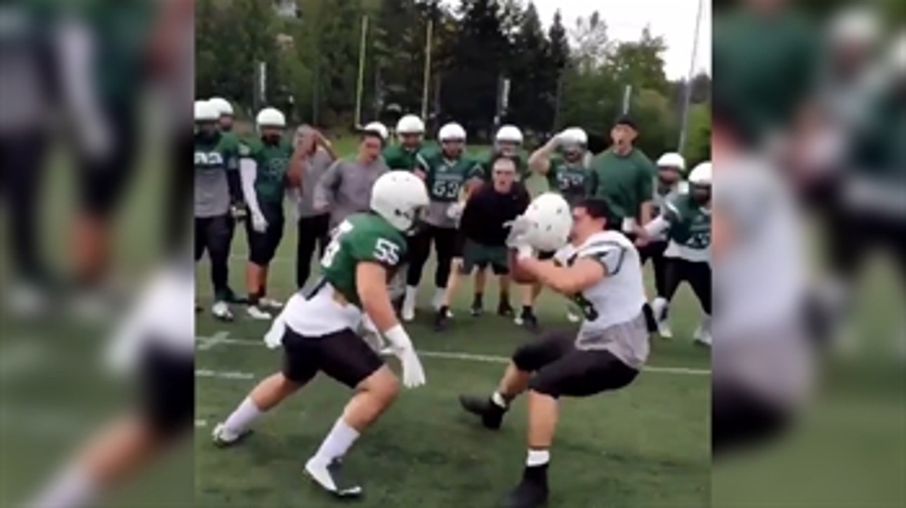 Watch a football player's helmet go flying off his head from a huge hit
