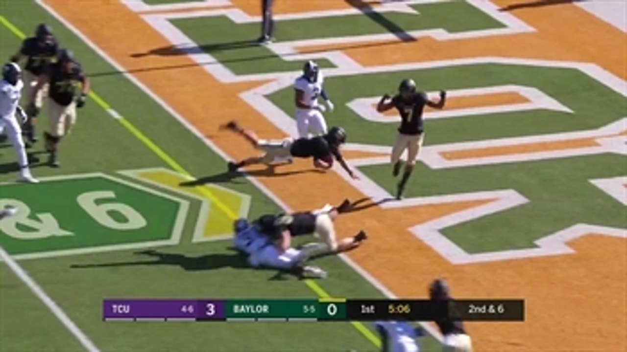 Baylor's Charlie Brewer leaps over a defender to give the Bears a 6-3 lead