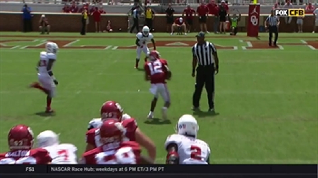 Referee 'tackles' Oklahoma WR A.D. Miller after he makes the catch