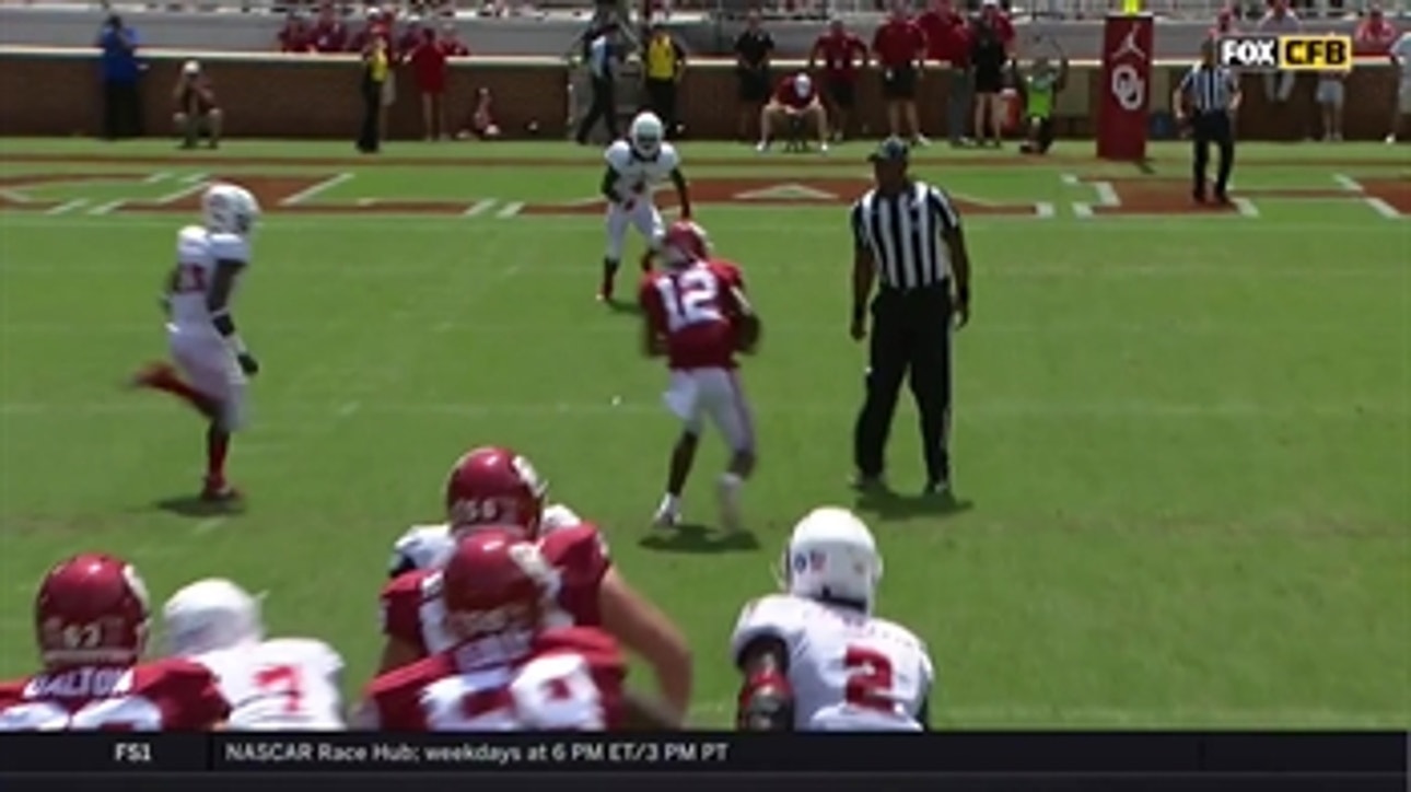 Referee 'tackles' Oklahoma WR A.D. Miller after he makes the catch