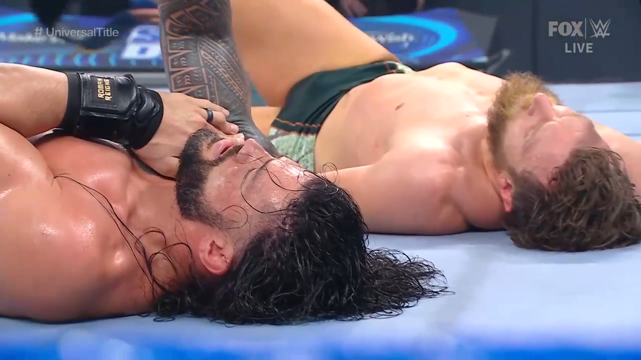 Roman Reigns leaves Daniel Bryan unconscious, banned from SmackDown after Universal Title Match