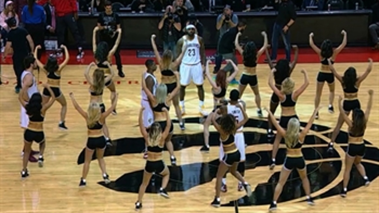 Cavs surrounded by Raptors dancers prior to opening tip