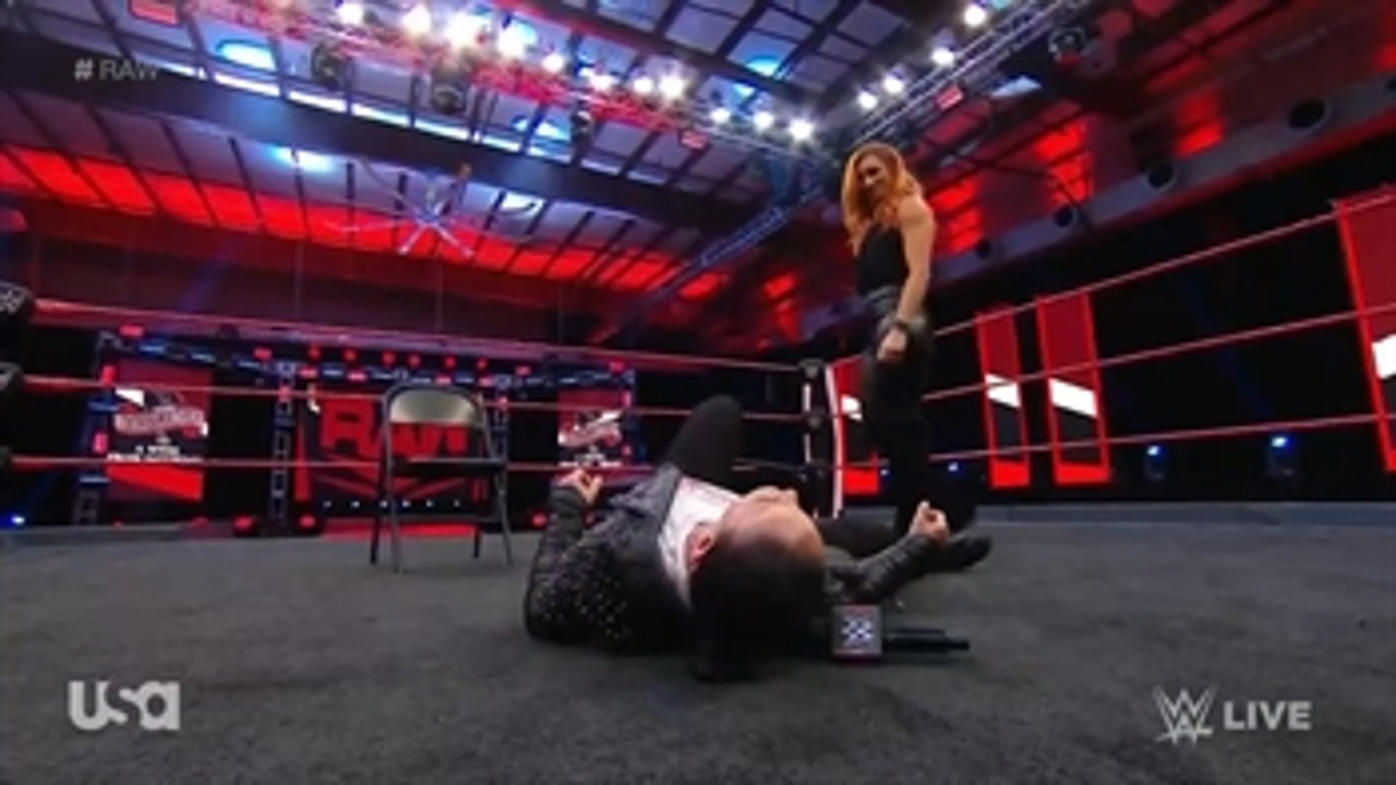 Becky Lynch attacks Shayna Baszler during a sit-down interview