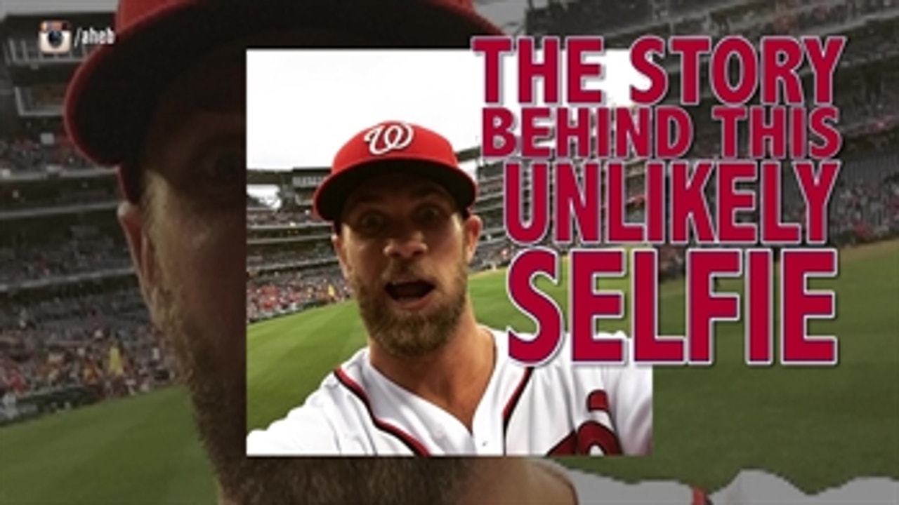 Bryce Harper borrows fan's phone to take selfie.