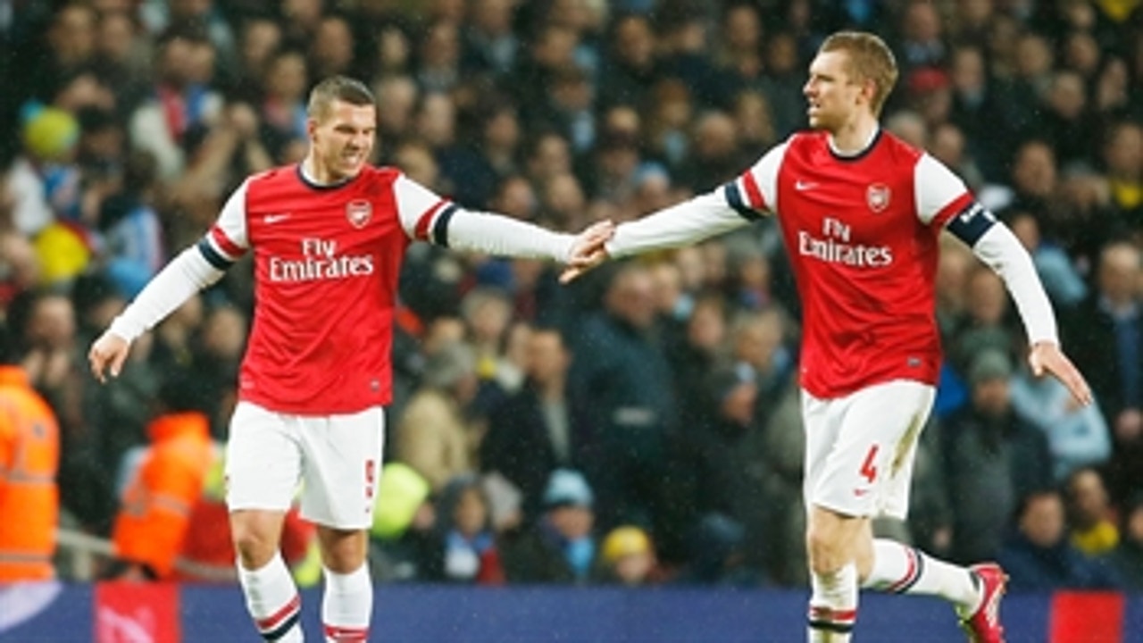 Podolski puts Arsenal ahead