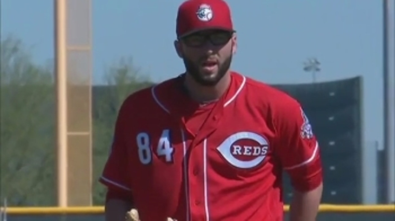 Why does Reds' Cody Reed wear glasses on the mound?