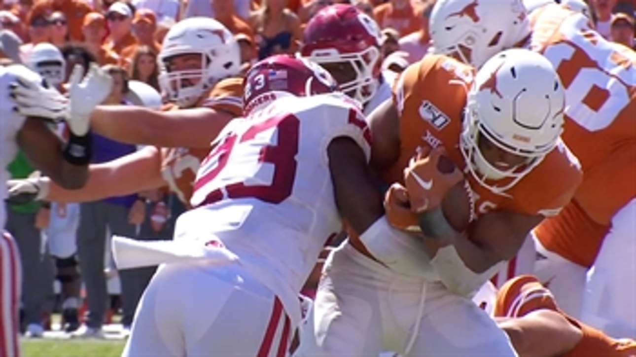 Texas' Roschon Johnson drives into the end zone for a touchdown