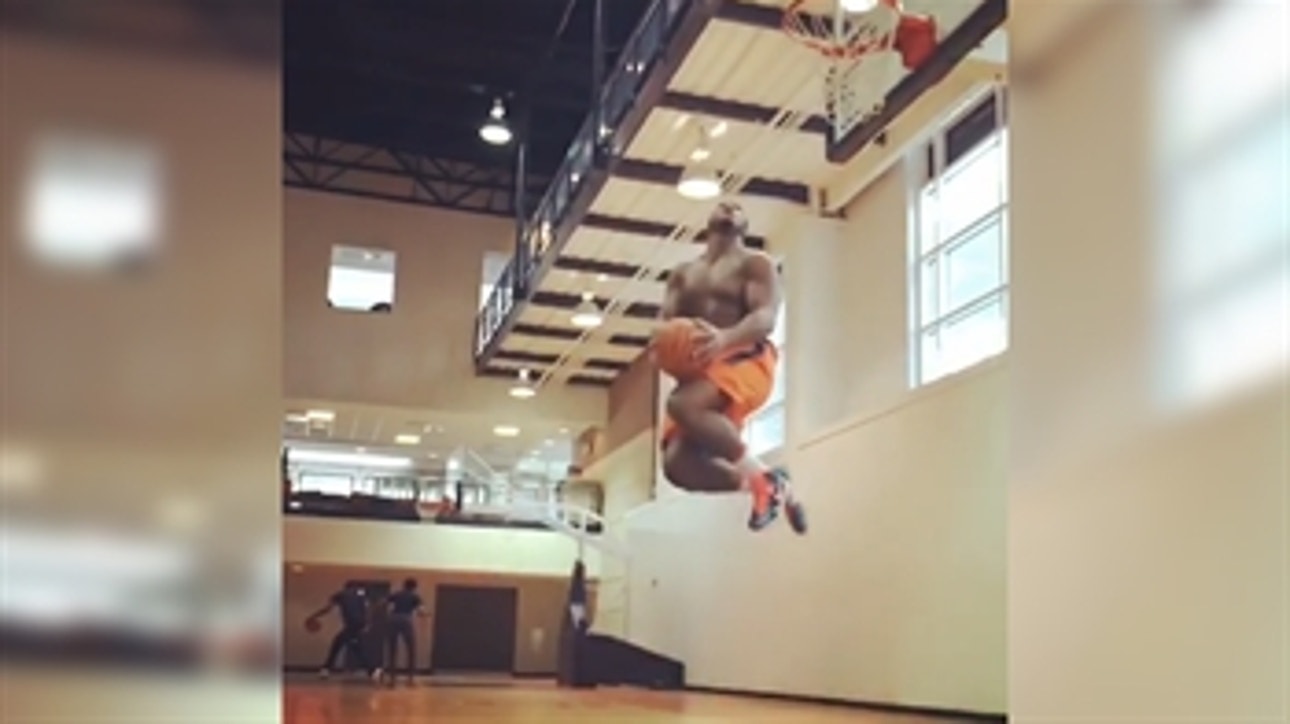 Giant college football DL throws down impressive reverse dunk … shirtless