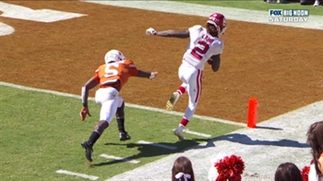 CeeDee Lamb takes a hit and stays inbounds for his third TD catch of the Red River Showdown