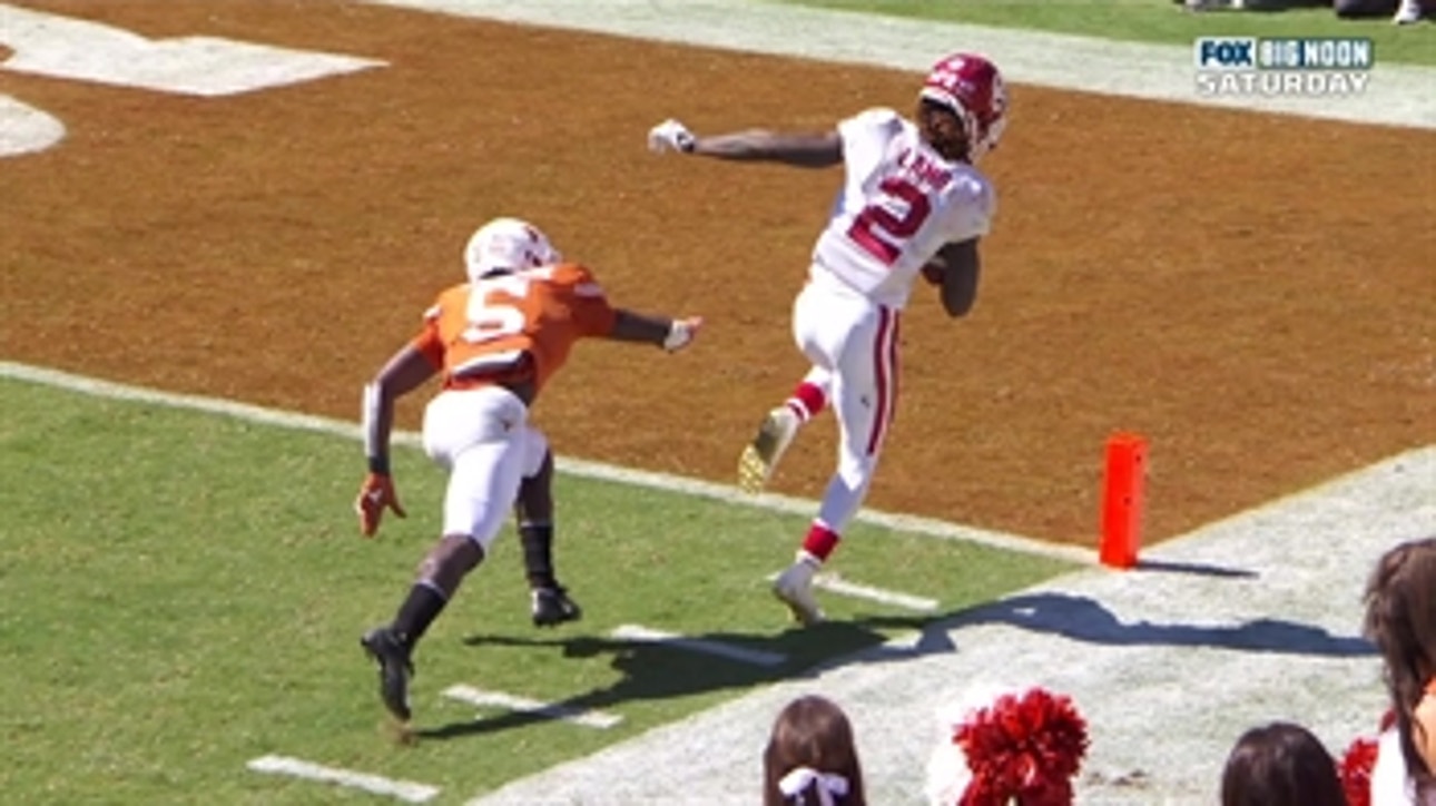 CeeDee Lamb takes a hit and stays inbounds for his third TD catch of the Red River Showdown