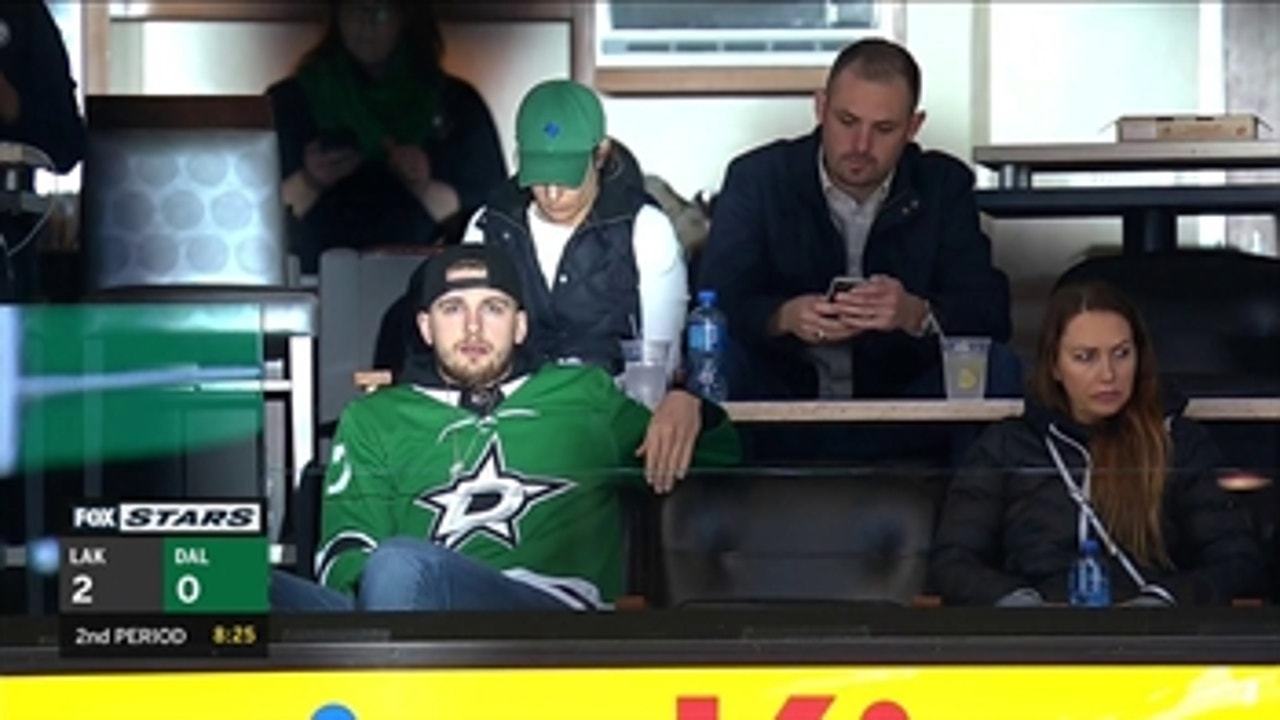 Luka Doncic takes in a Stars - Kings game