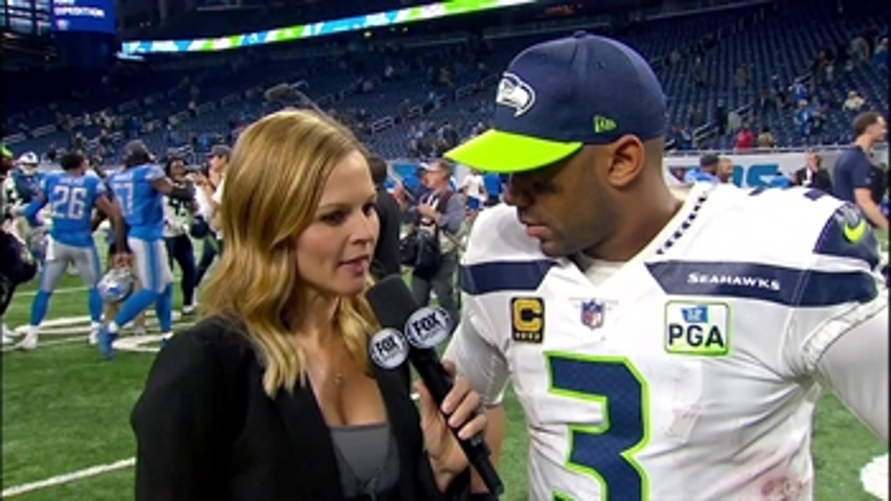 Russell Wilson talks to Shannon Spake after setting a Seahawks milestone against the Lions
