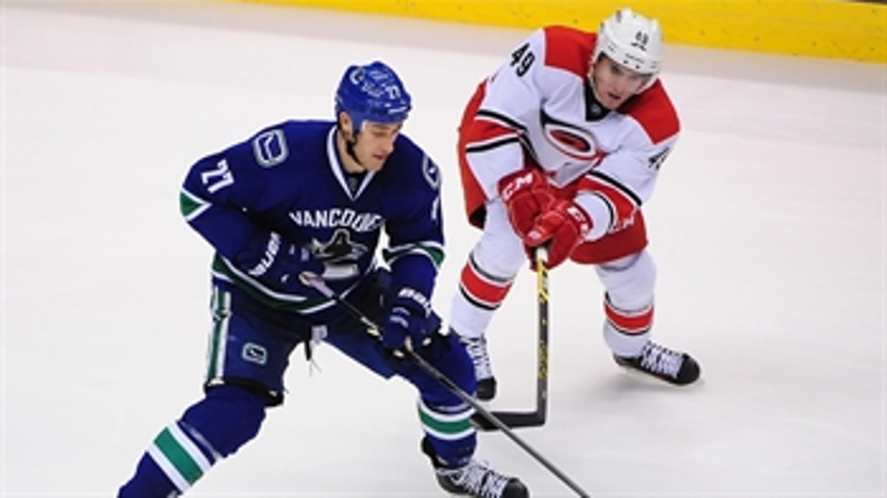 Hurricanes' skid continues with loss to Canucks