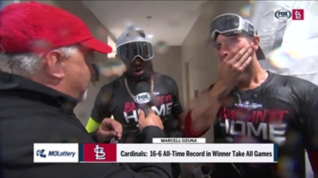 DeJong and Ozuna celebrate in Cardinals clubhouse