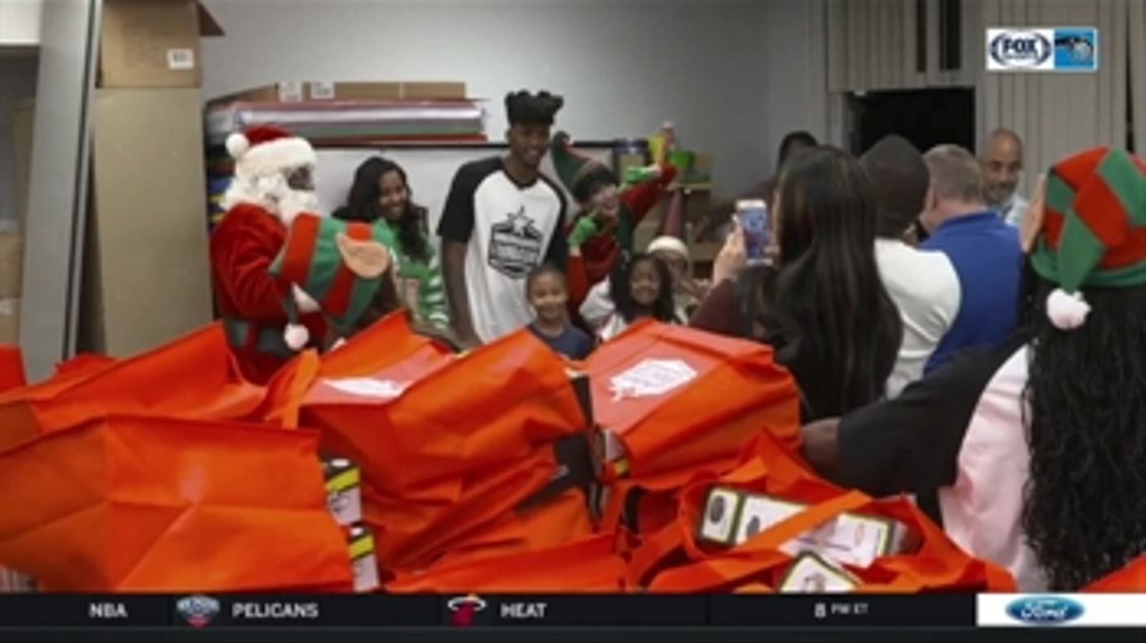 Magic guard Elfrid Payton dishes out gifts to elementary school students