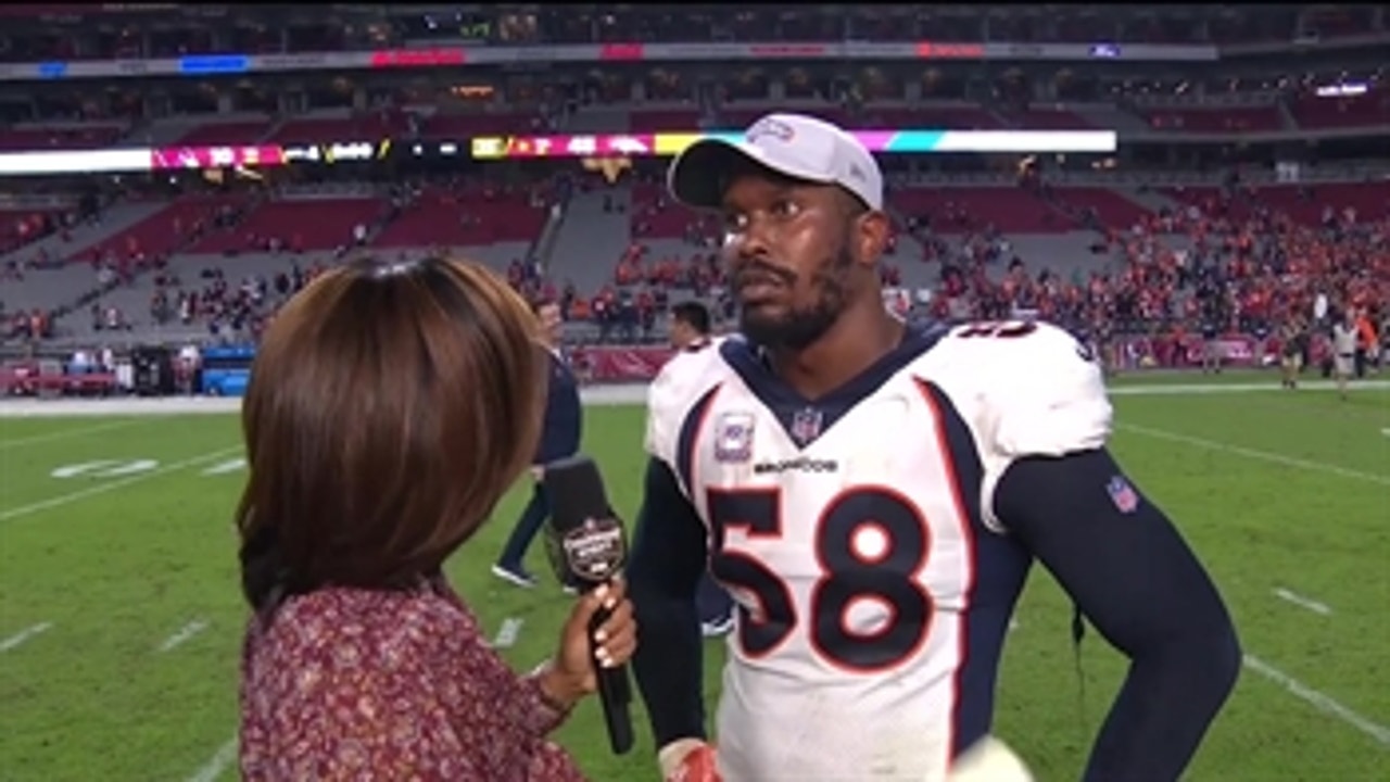 Von Miller talks with Kristina Pink after the Broncos lopsided win over the Cardinals
