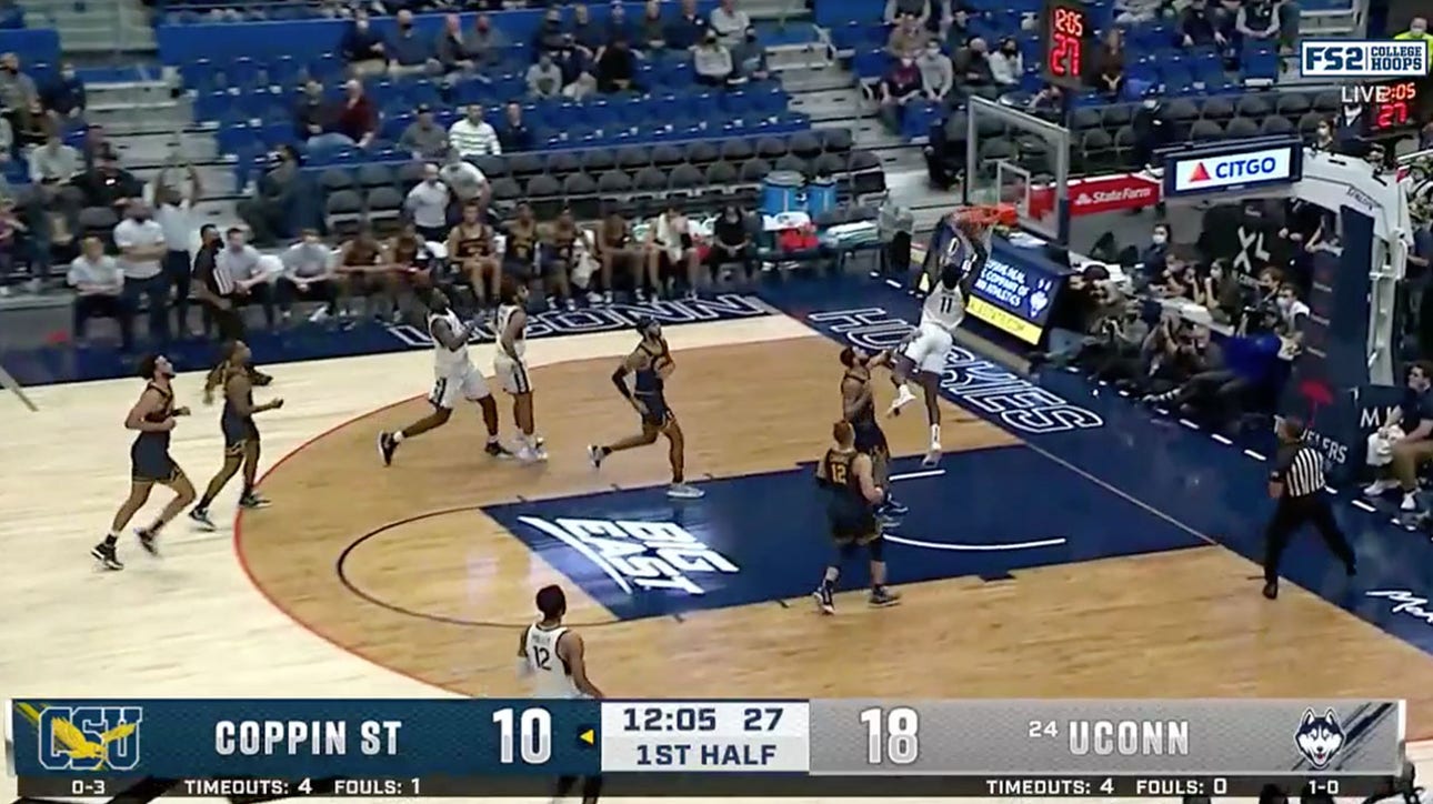 Akok Akok puts down the alley-oop dunk to advance UConn's early lead