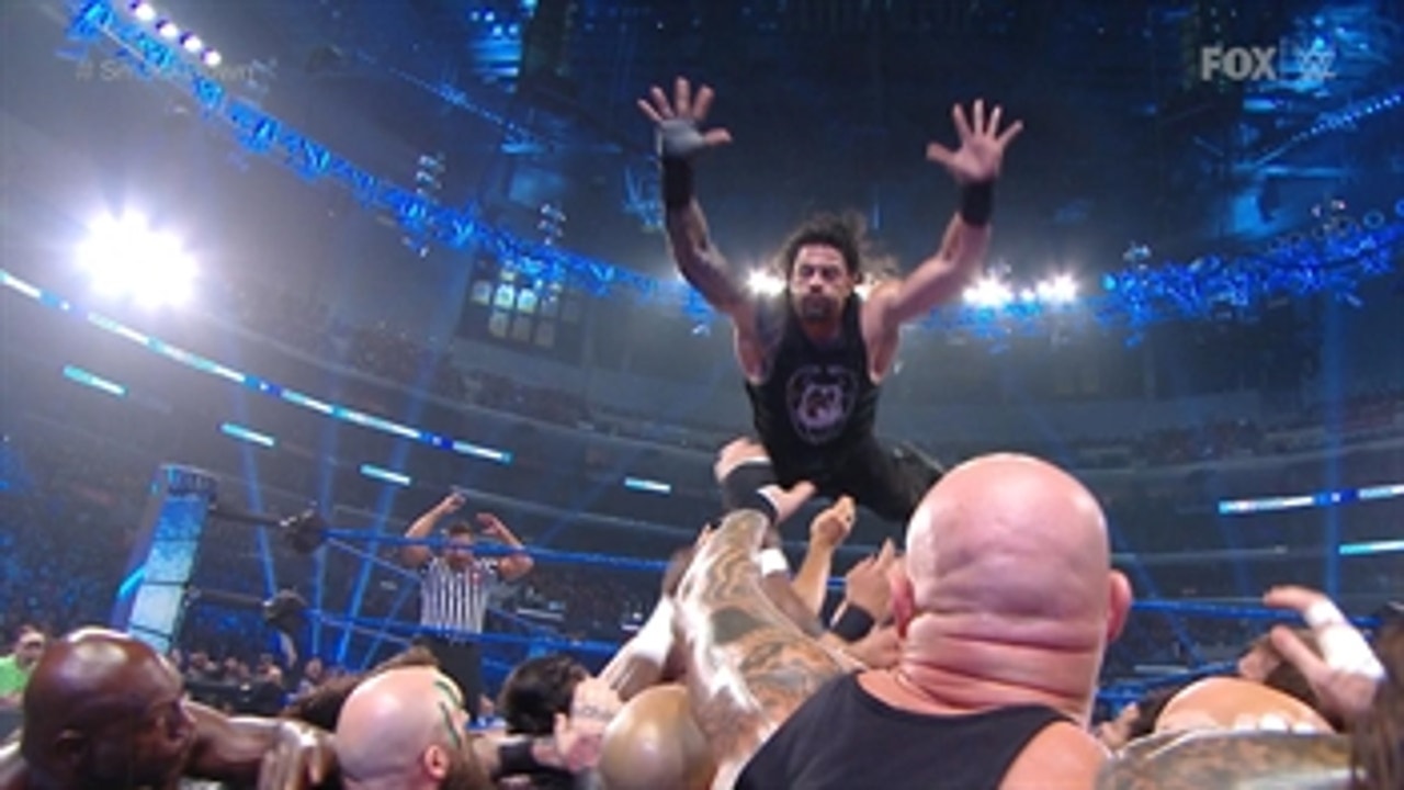 Roman Reigns springboards into the lumberjack pile on SmackDown
