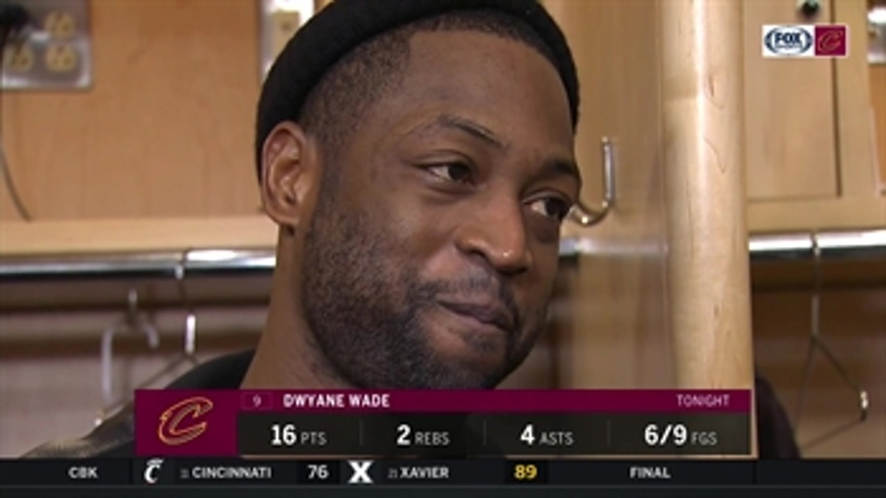 Wade answers questions while LeBron can be heard cheering on OSU in the background