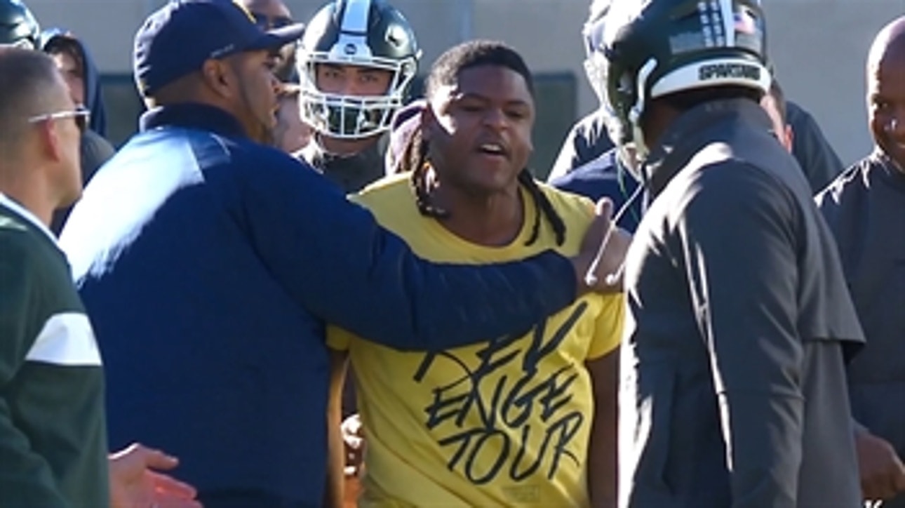 Michigan player viciously defaces the Michigan State logo following pregame altercation