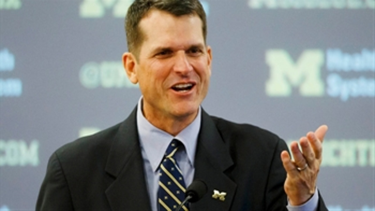 Harbaugh signs 7-year deal with Michigan