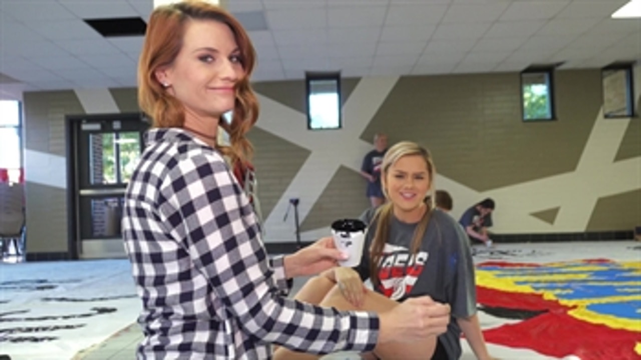 Katy cheerleaders carry tradition of giant run-through banners | Team Behind The Team