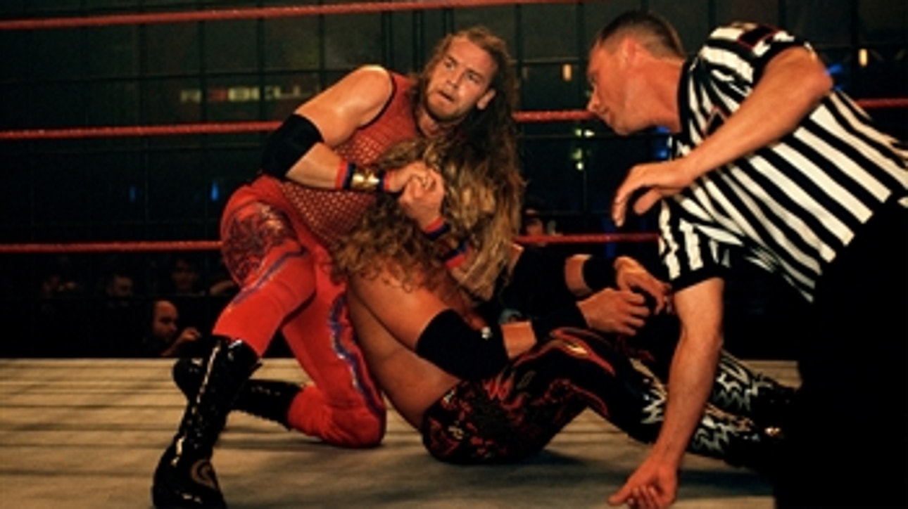 Edge battles Christian inside a Steel Cage: WWE Rebellion 2001