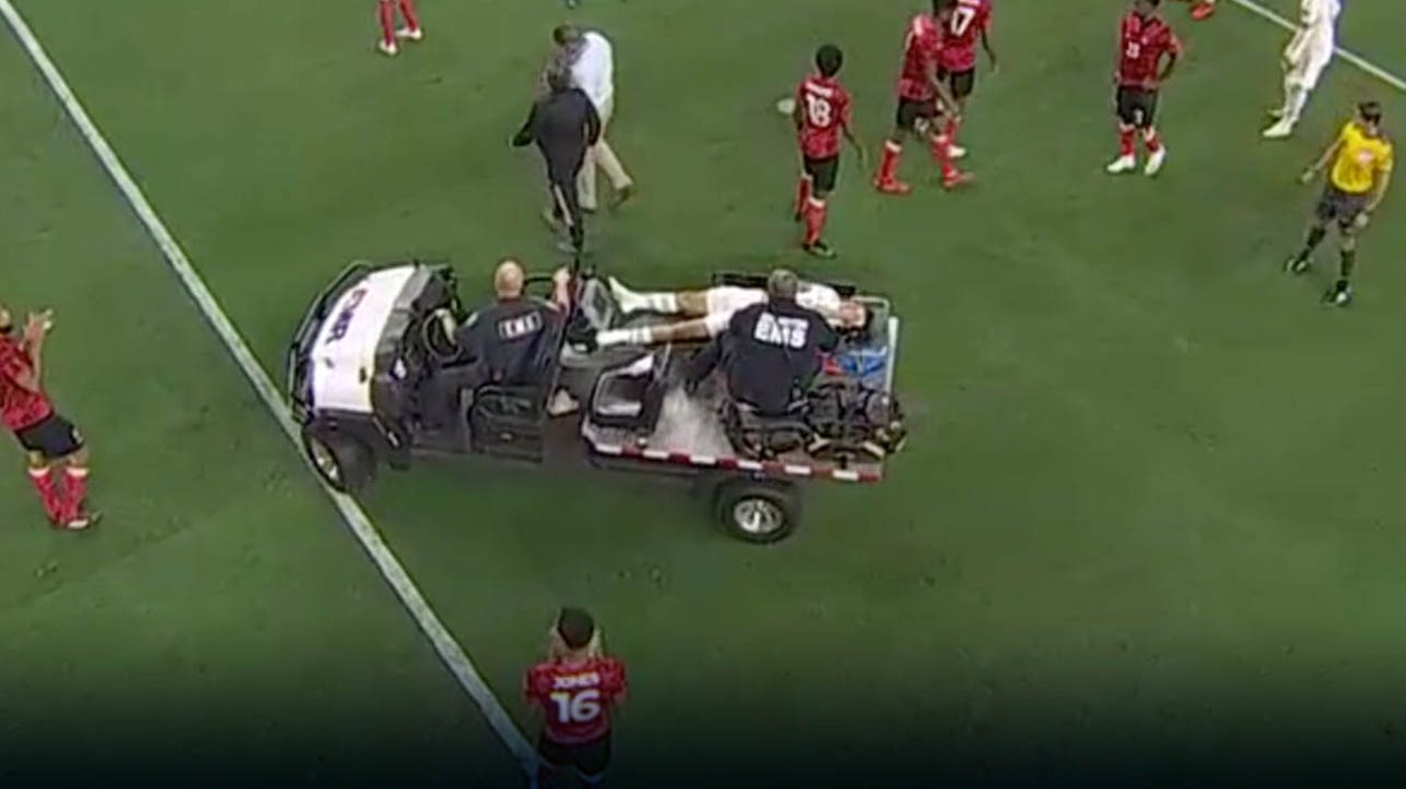 Chucky Lozano is carted off the field after terrifying collision with Trinidad & Tobago goalkeeper