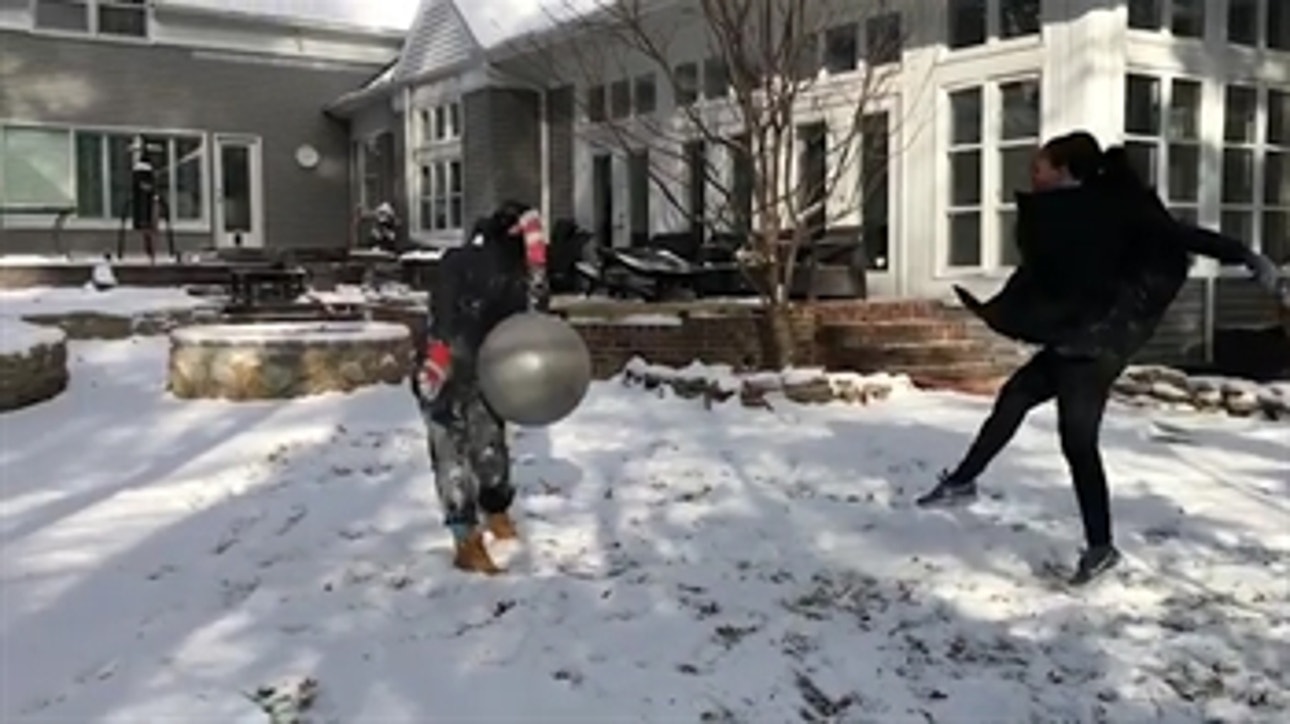 Soccer power couple kick balls at each other for fun