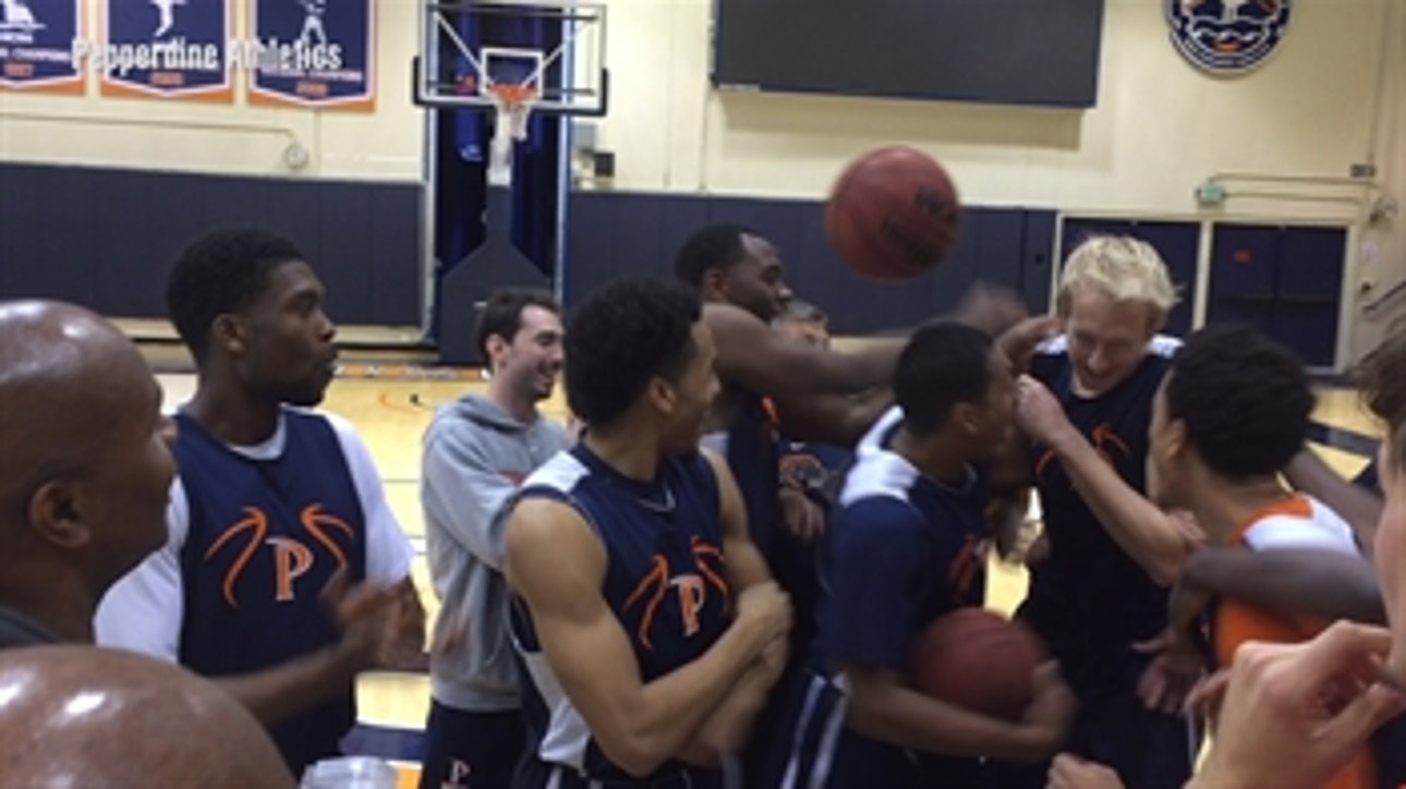 Watch a college hoops team go nuts when walk-on gets awarded scholarship