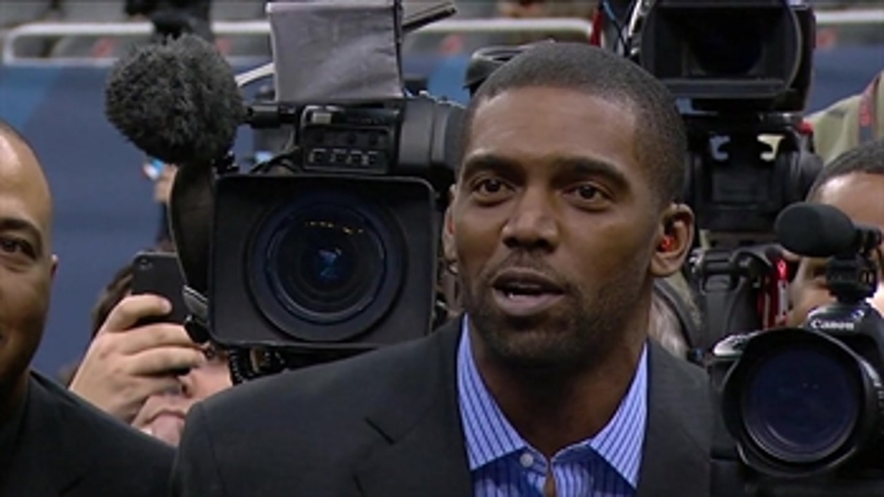Randy Moss gets in the media scrum