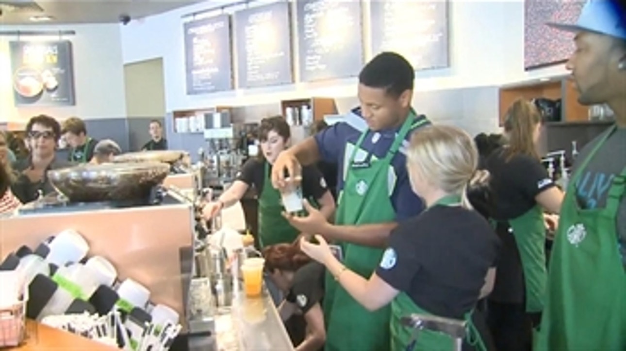 Seahawks' Pete Carroll, Malcolm Smith serve coffee at Starbucks