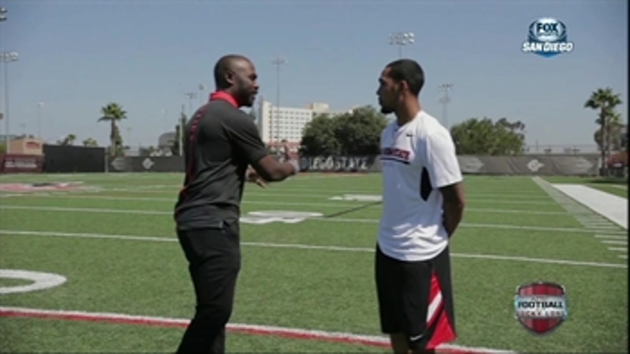 Marshall Faulk offers advice to SDSU running back Donnel Pumphrey