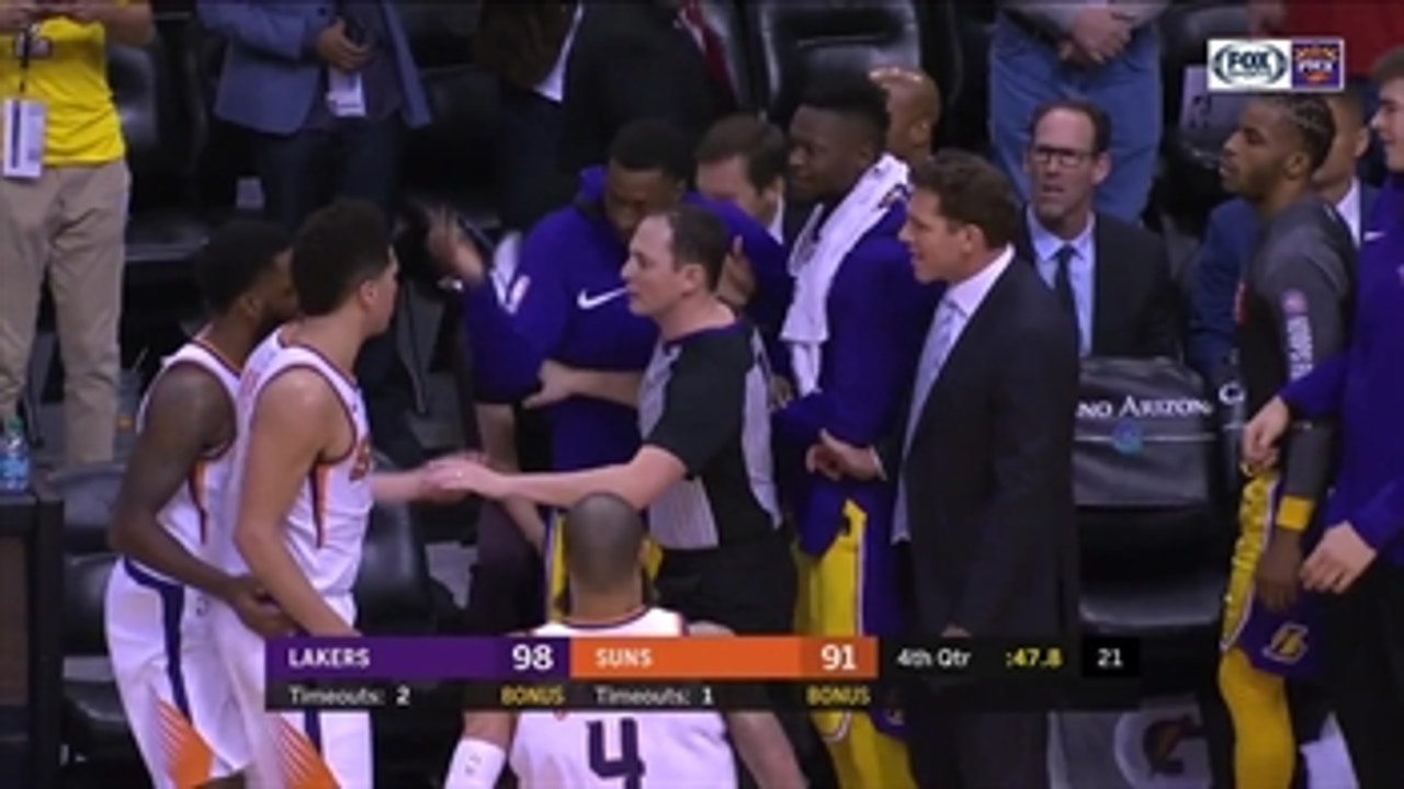 Devin Booker exchanges words with Lakers' bench