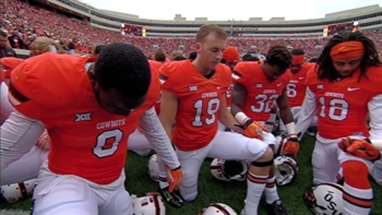 Oklahoma State players kneel and pray after Stillwater Homecoming tragedy
