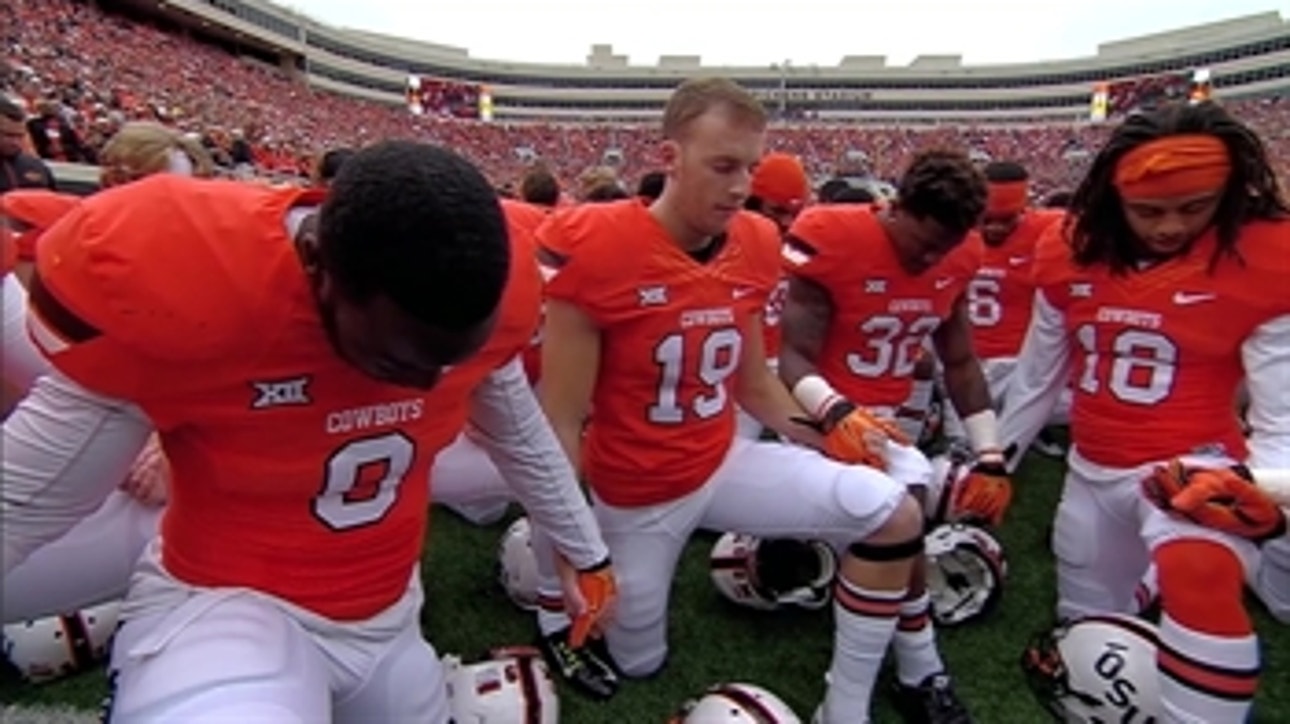 Oklahoma State players kneel and pray after Stillwater Homecoming tragedy