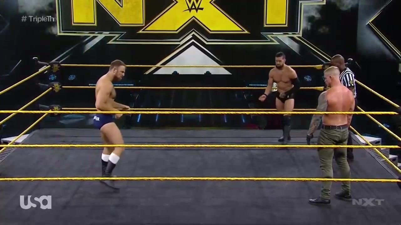Finn Balor, Dexter Lumis, and Timothy Thatcher compete in a triple-threat match