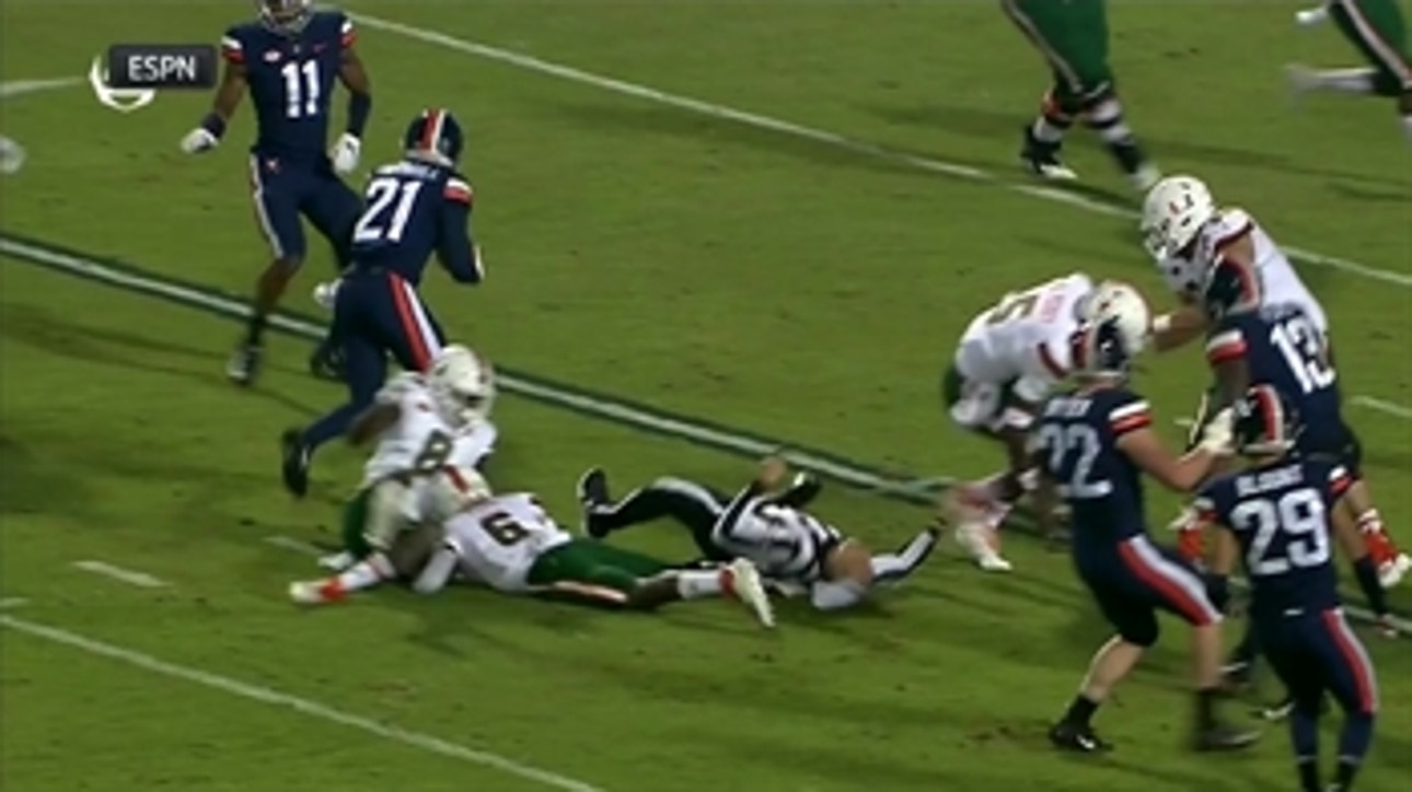 Referee takes massive, scary hit in Miami-Virginia but gets up and stays in the game