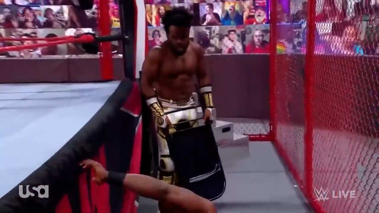 Xavier Woods beats Bobby Lashley with a steel chair in Hell in a Cell match