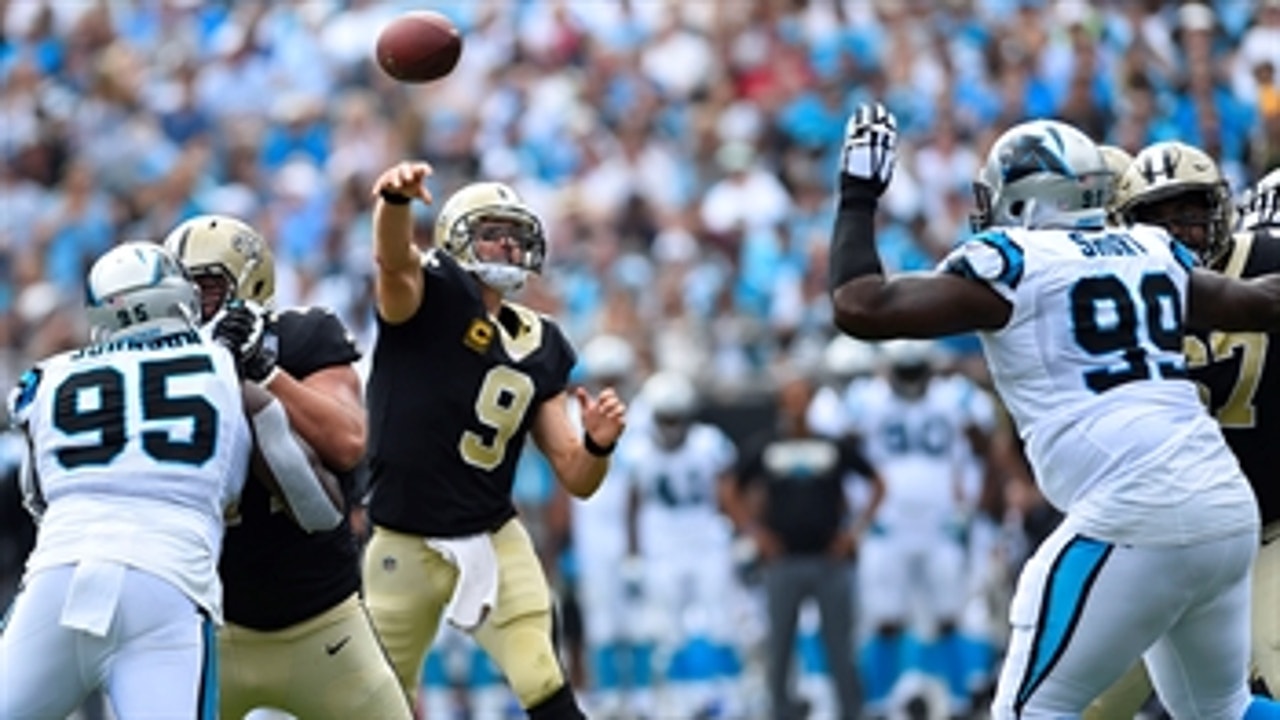 Easy Brees-y: Drew Brees heaves a 40-yard TD strike to Ted Ginn Jr. in the Saints'  34-13 rout over the Panthers