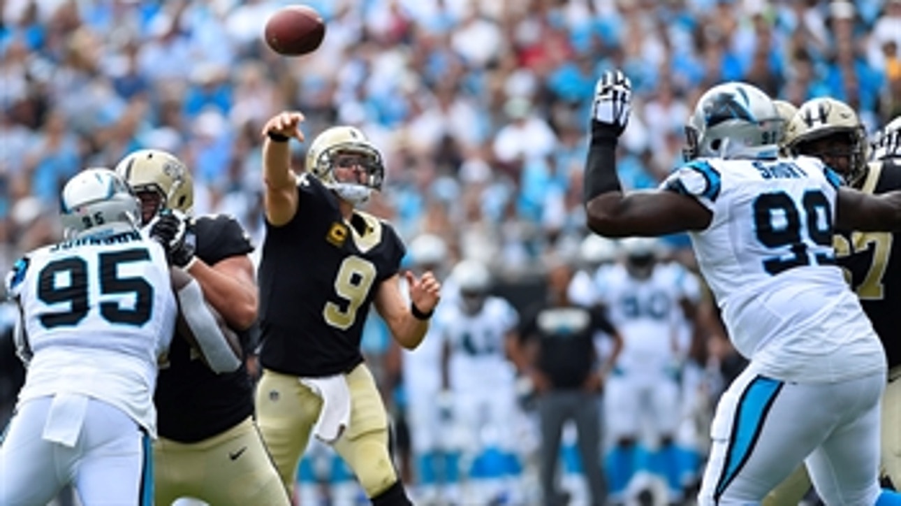 Easy Brees-y: Drew Brees heaves a 40-yard TD strike to Ted Ginn Jr. in the Saints'  34-13 rout over the Panthers