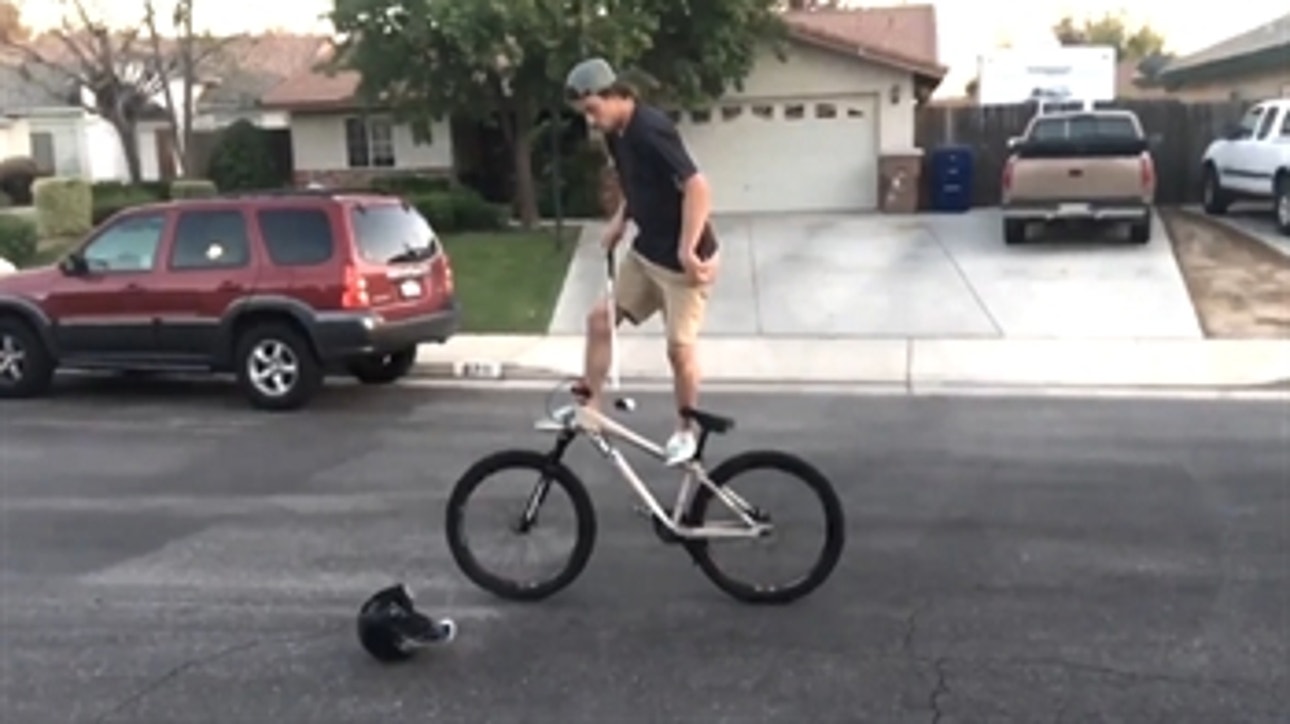 Don't try this trick golf shot at home … or least wear a helmet if you do